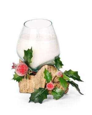 Γυάλινο κερί με χριστουγεννιάτικη διακόσμηση και φύλλα.